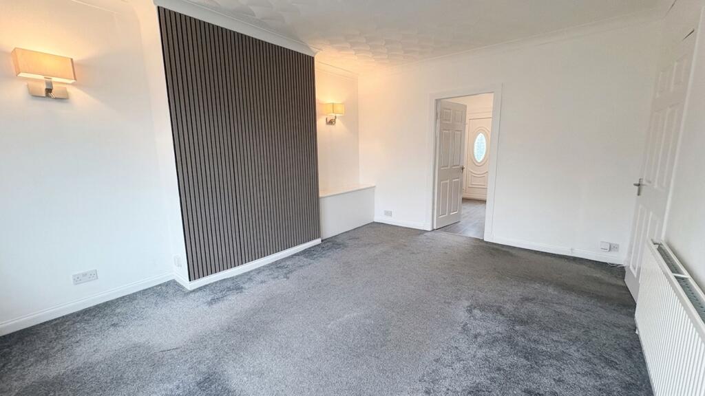 Freshly refurbished living room of a Knightswood flat let by Hoose & Key